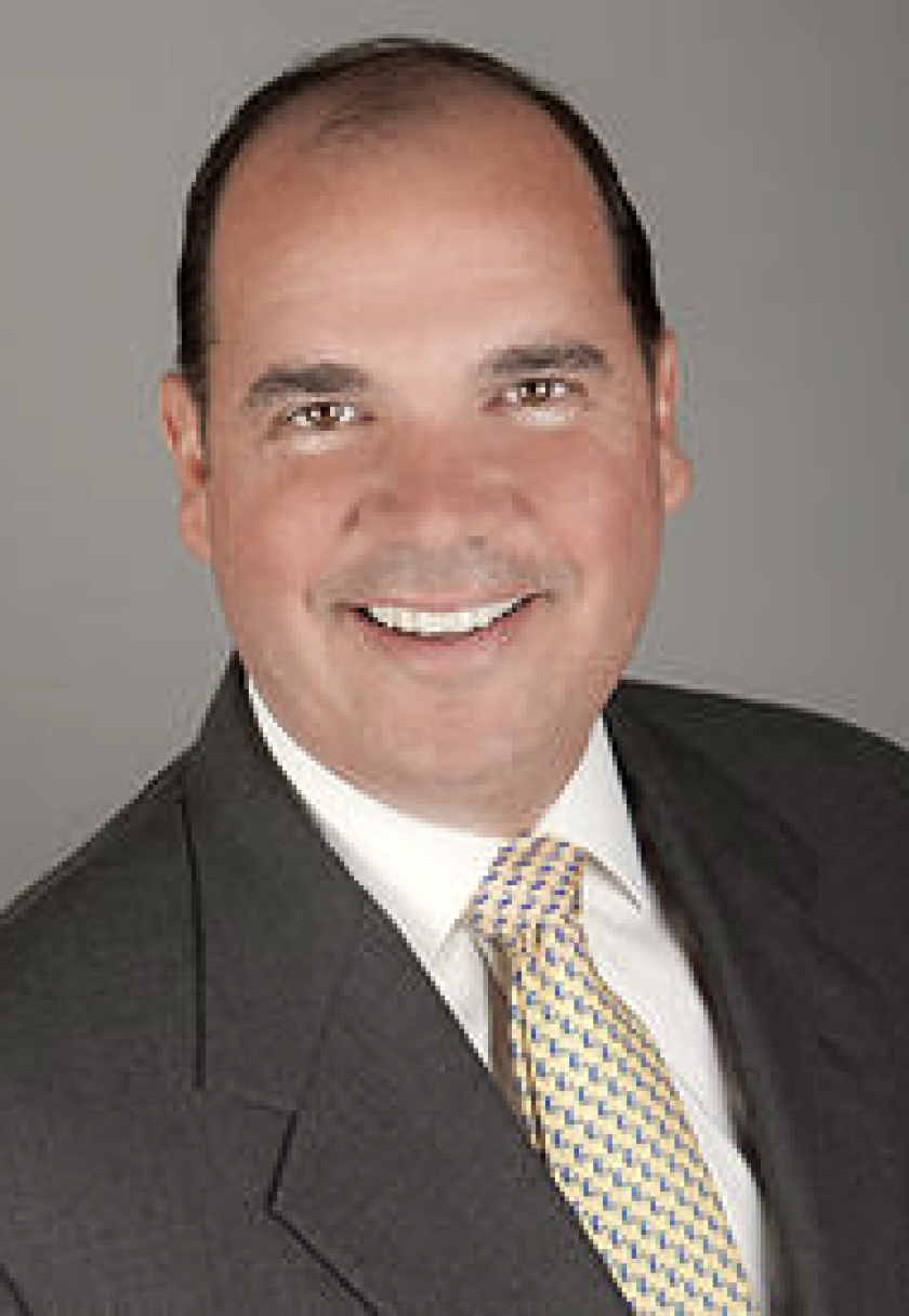 Headshot of William H. Holly of Patton Real Estate smiling in business attire.